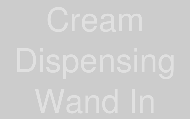 A professional cream whipping device setup shown in kitchen environment